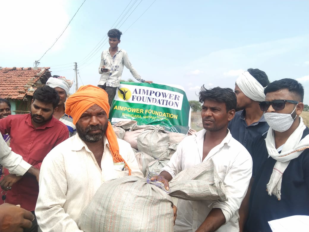 Community members receiving relief materials